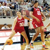 Emmary Elizondo (30) steps away from a screen by West teammate and fellow EHS alum Lilly Thomas (00)