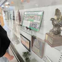 Rhonda Elmenhorst looks over one of the displays that covers the GFY’s history at the school