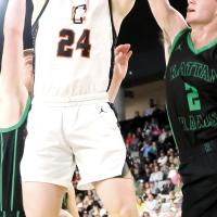 Kaleb Thiessen splits two Rattan defenders to get off a shot