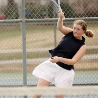 Serenity Billings follows through on an overhand return shot