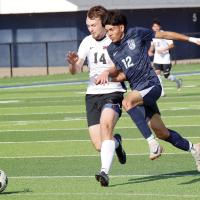 Vicente Saldana Barbosa collides with a Westmoore player