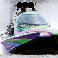 Jimmy Kemp drives out of a wall of water with his capsule boat