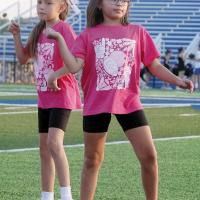 Khloe Little (in glasses) joins another camper as they make a turn