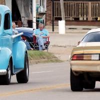 Vintage cars fill the city streets