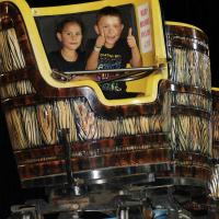 Children gave a thumbs up to one of the carnival rides
