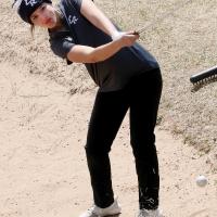 Shayne Castrop hits a low shot out of a fairway bunker