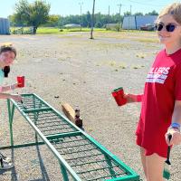Alexis Haynes (left) and Kylie Detrick helped get the new dunk tank ready