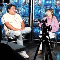 Zachary Blackowl is being interviewed by tribal youth during the Visuals and Media Camp