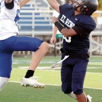 Issac Salgado gets off a pass under heavy pressure by a Bluejays rusher