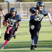 Brent Parker runs behind blocker Kaleb Dennis