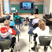 Chip Whitworth discusses with his students a video shot in 2001 of the 9/11 attacks 