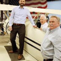 Matt Sandidge, left, with Tony Caldwell and Scott Law inside a hangar at El Reno Regional Airport
