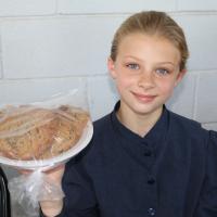 Abigail LePelley is all smiles selling fresh, homemade cookies