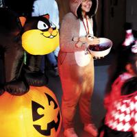 Abrielle Vanderschans hands out treats to youngsters
