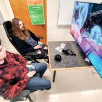 Aden Gilleland, left, and Jayden Grauberger take on another school in a game of Mario Kart