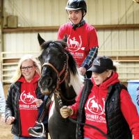 Alan Barbosa is all smiles while galloping during a recent class