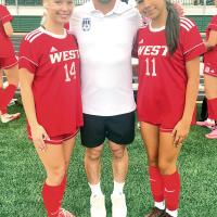 Anthony Klipp with Lily Hayes (14) and Grisell Guzman (11)