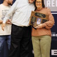 Angela Lesperance gets a hug from El Reno Superintendent Matt Goucher after being named District Teacher of the Year