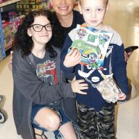 Liz Hodgson poses with her little shoppers, Jessica Parson (left) and Lyric Kaup