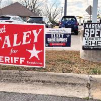 Campaign signs for the three Republican candidates for Lonoke County sheriff are on display