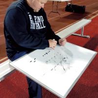 Chuck Atchison draws up a play