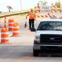 A worker measures off distances