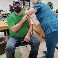 Brad Baker gets his first dose of the COVID-19 vaccine
