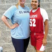 Jaylin Reveles poses with head coach Jennifer Douglas