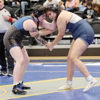 Bentley Sharp (right) locks up with a Piedmont wrestler 