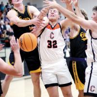 James Daughety and Dalton Belcher battle Caden Schieber (left)