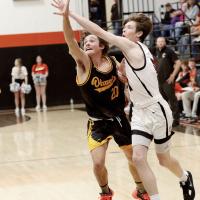 Wyatt Pinkerton and Hunter Arnold battle for control of a loose ball