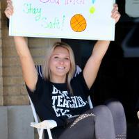 Breck Clark holds up a sign