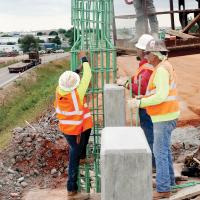Frontier Bridge workers form rebar to reinforce the concrete
