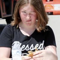 Karla Wieland makes a funny face while trying to swallow a bite