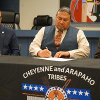 Gabe Morgan signs the official documentation placing more than 90 acres at Country Club and I-40 in trust for the Cheyenne and Arapaho Tribes