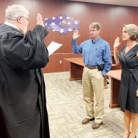 Joe Anderson and Heather McCarty are sworn in by Judge Bob Hughey