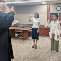 Judge Bob Hughey swears in three new CASA volunteers