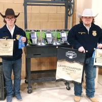 Dalton Garcia (left) and Mason Broadway show off the grand champion award and other honors