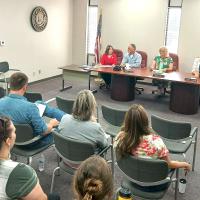 Canadian County commissioners conducted their first meeting inside the conference room of the county’s temporary administration building