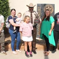 Sgt. David Cates poses with his family for photos