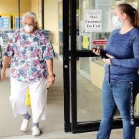 United Supermarket employee keeps track of the number of customers