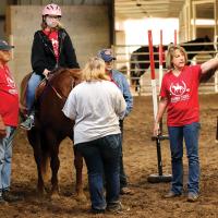 Andi Holland offers directions to Caitlyn Lacefield