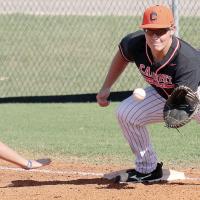 Carson Cooper looks a pickoff throw into his glove