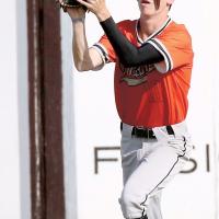 Hunter Arnold runs under a fly ball