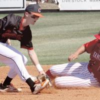 Kyler Thiessen tags a runner after snagging a throw into second
