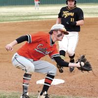 Caleb Meschberger steps off the bag to grab a pickoff throw