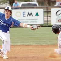 Blake Bailey stretches out but was unable to reach a wide pickoff throw