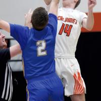 Matt Snyder outjumps a player for control of the opening tipoff