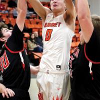 Kaleb Melvin splits defenders to get off a shot