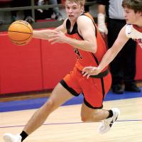 Matt Snyder drives past a defender